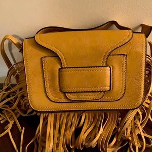 Beautiful tan fringe purse with several pockets